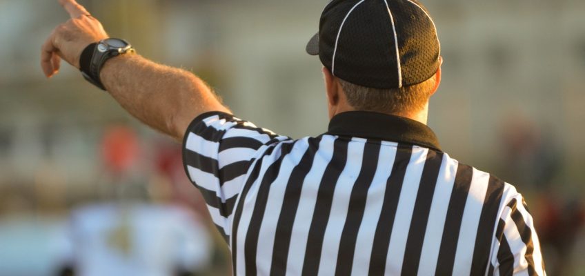 A referee determines right and wrong on the field