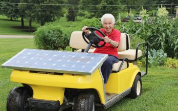 Sister Paula Gonzalez, the solar nun, drives a golf cart powered by solar panels.
