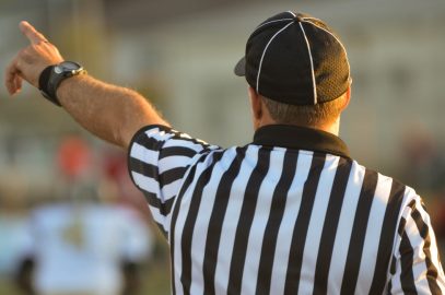 A referee determines right and wrong on the field